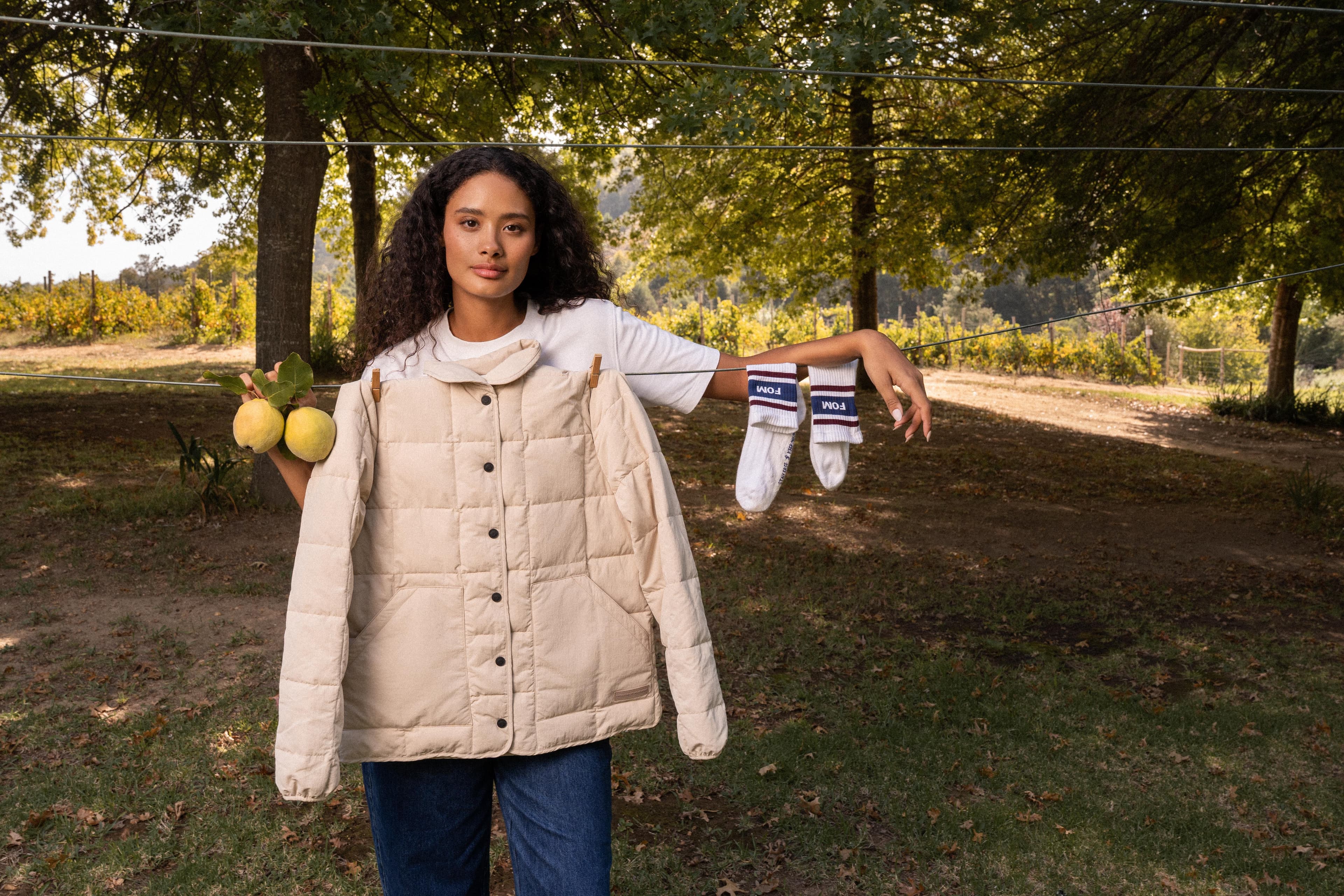 Outdoor editorial with quilted jacket and lemons